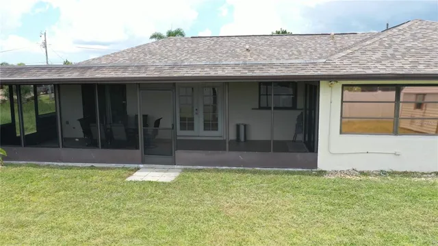 a view of a house with backyard and tub