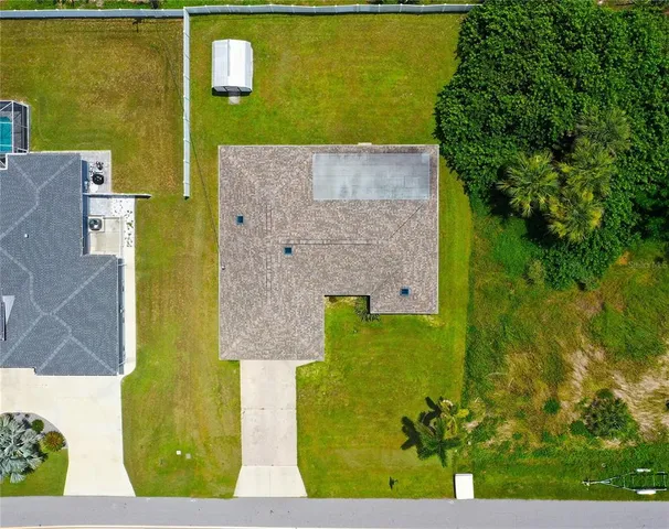 aerial view of a house with a yard
