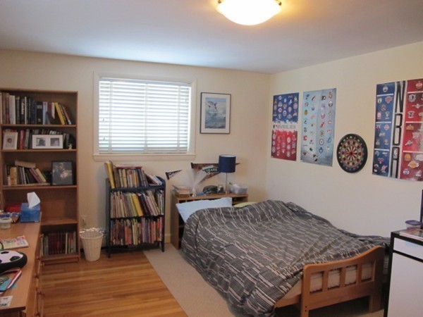 36 Edwardel Road Needham, MA 02492 - Photo 10 of 18 a bedroom with a bed and a bookshelf