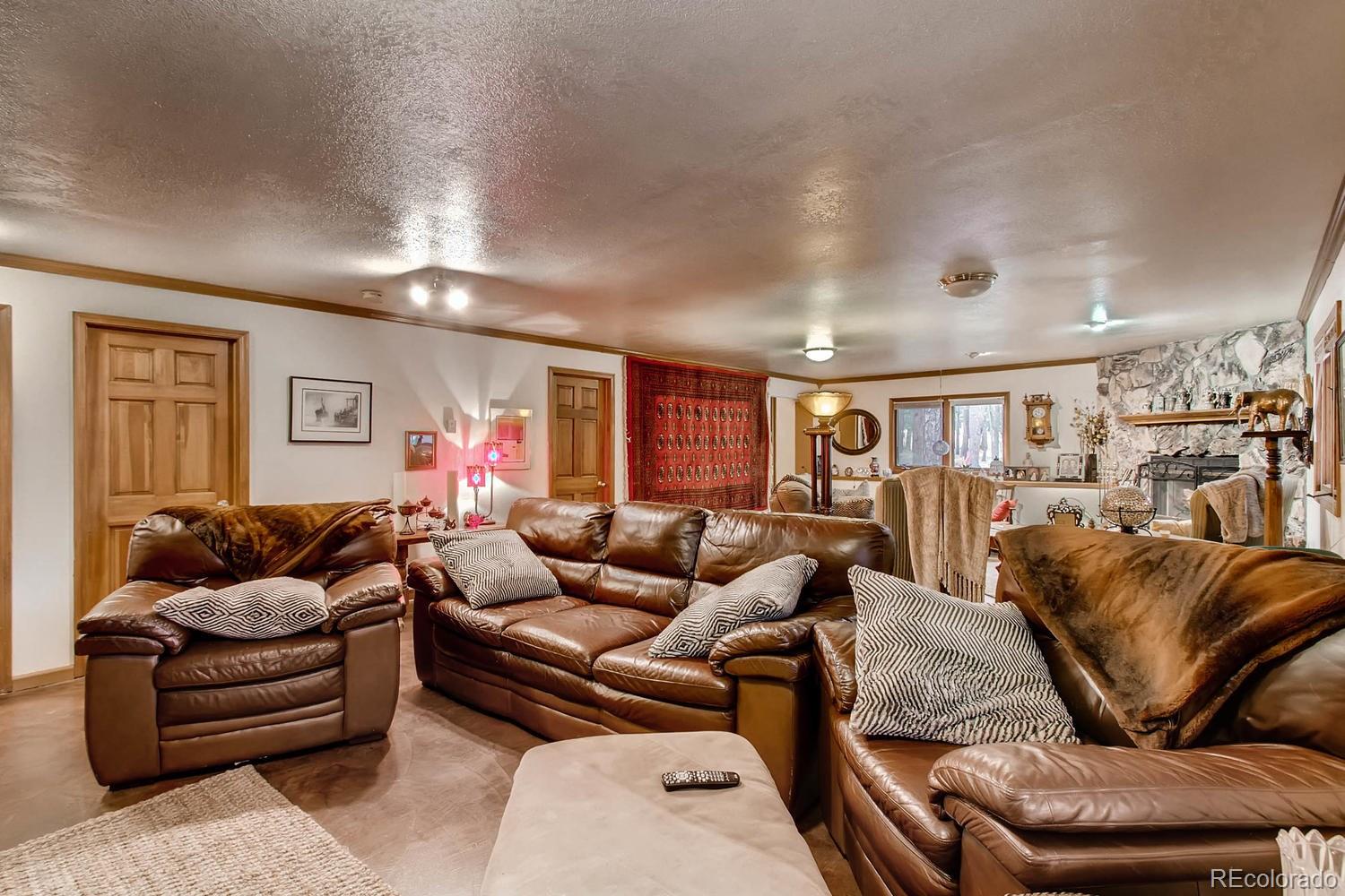 8060 Cyprus Road Colorado Springs, CO 80908 - Photo 20 of 28 a living room with furniture and a couch