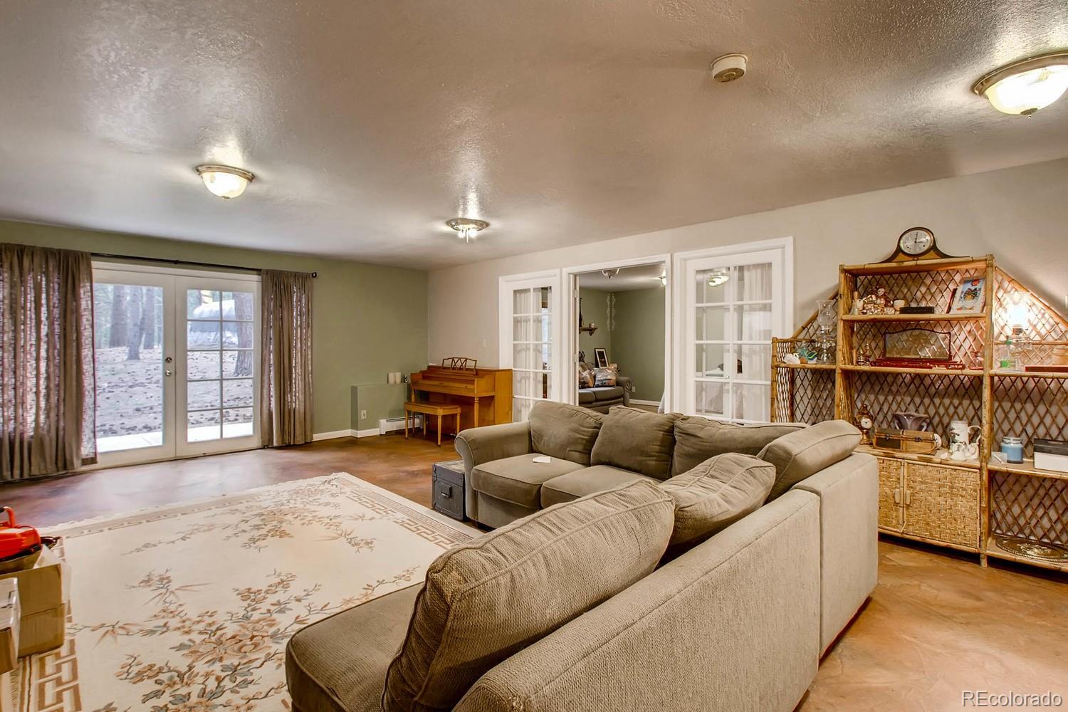 8060 Cyprus Road Colorado Springs, CO 80908 - Photo 22 of 28 a living room with furniture and a window