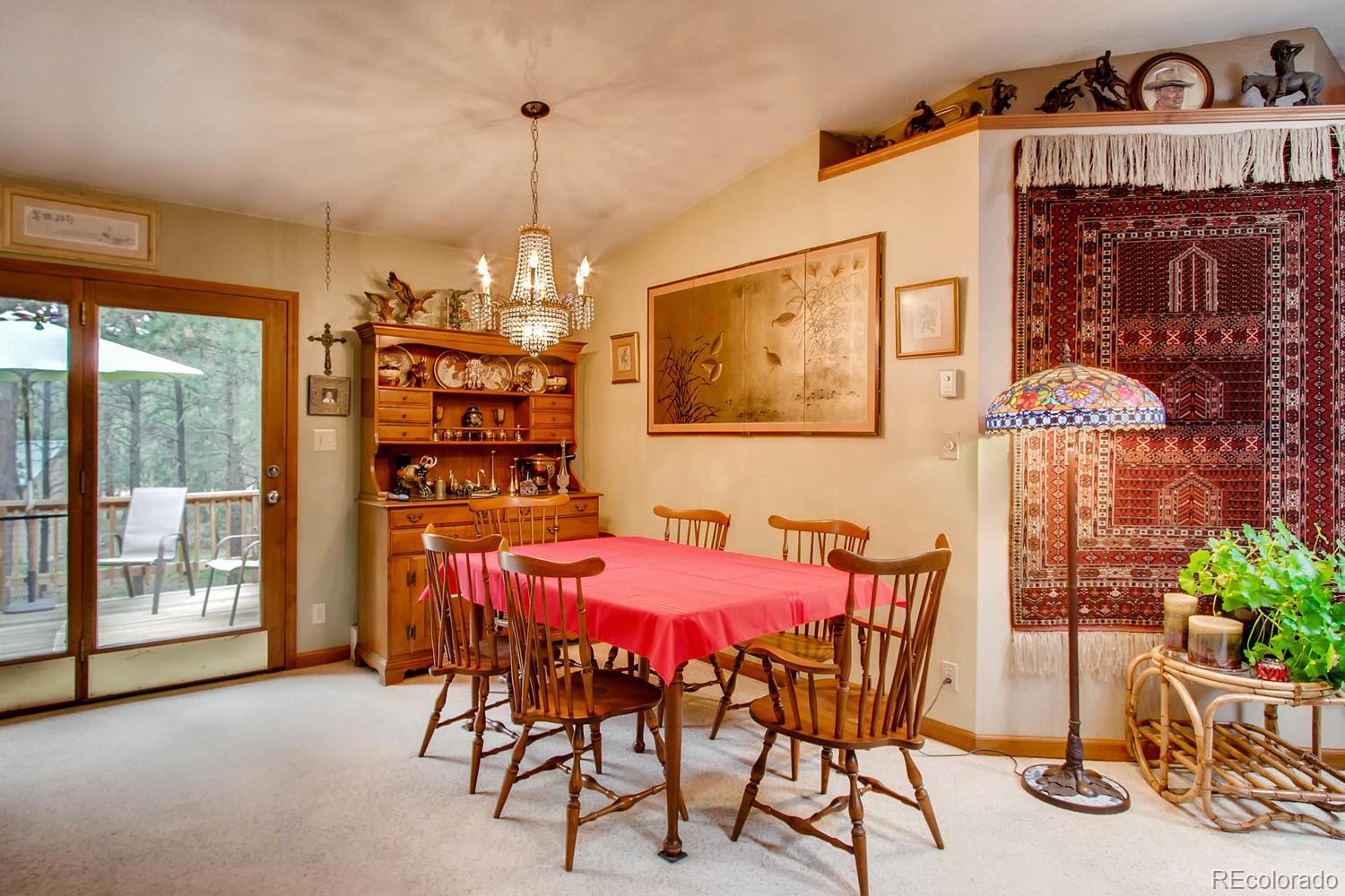 8060 Cyprus Road Colorado Springs, CO 80908 - Photo 7 of 28 a view of a dining room with furniture window and outside view