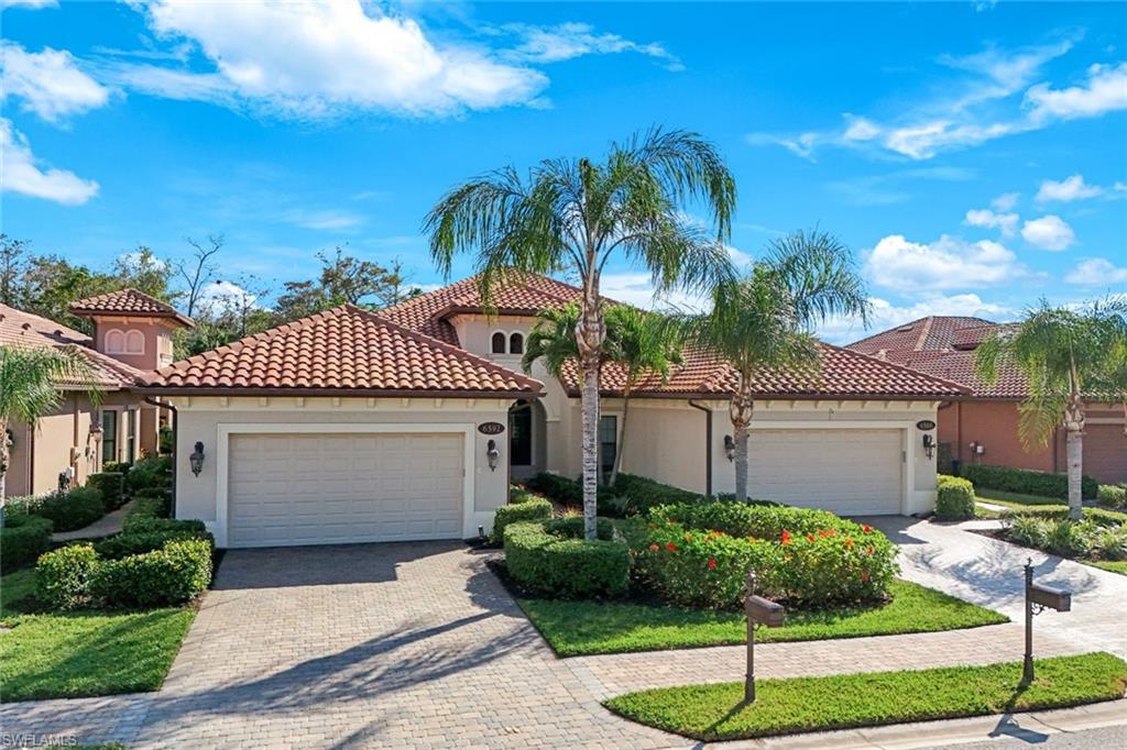 6592 Roma Way Naples, FL 34113 - Photo 31 of 41 Mediterranean/spanish-style house featuring an attached 2-car garage