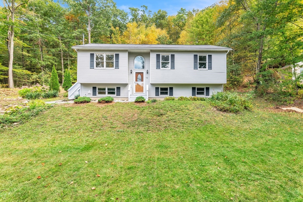 52 Warren Wright Road Belchertown, MA 01007 - Photo 1 of 41 a view of a house with a yard