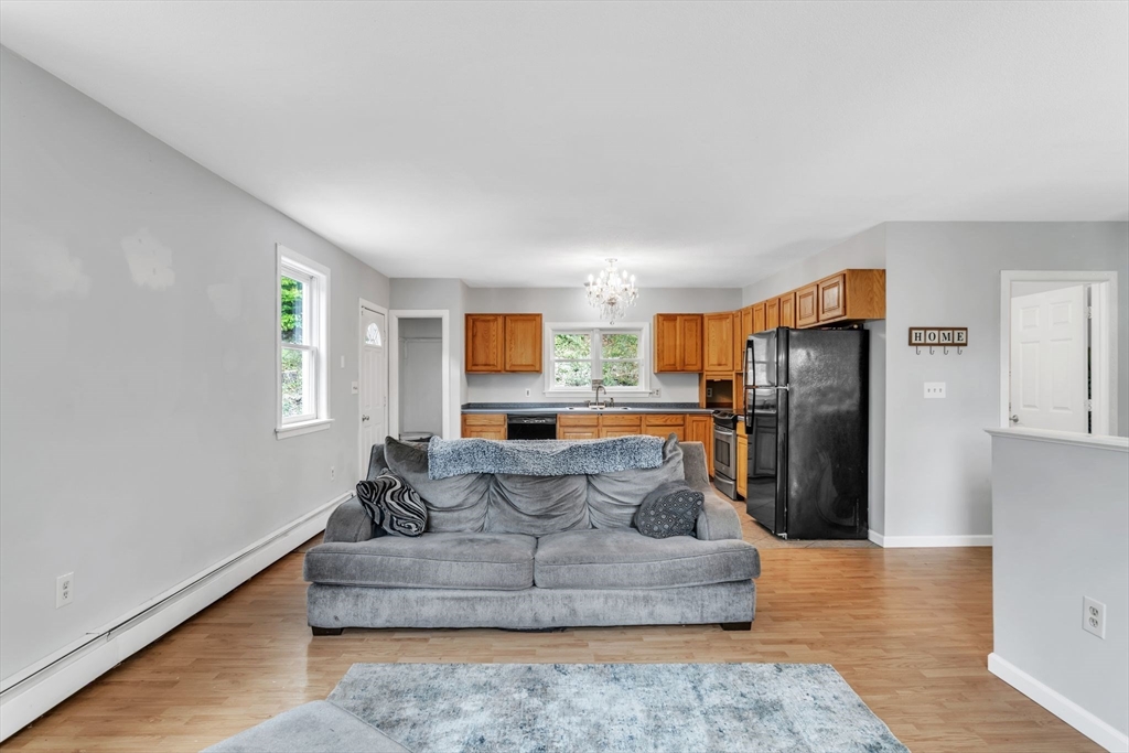 52 Warren Wright Road Belchertown, MA 01007 - Photo 11 of 41 a living room with furniture and kitchen view