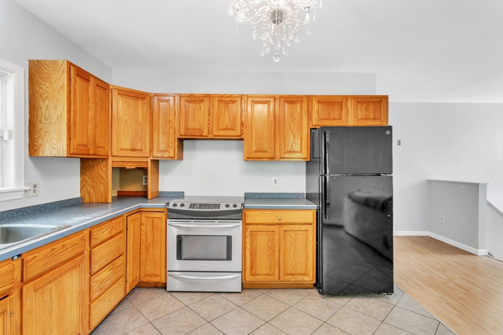 52 Warren Wright Road Belchertown, MA 01007 - Photo 15 of 41 a kitchen with a sink cabinets and appliances
