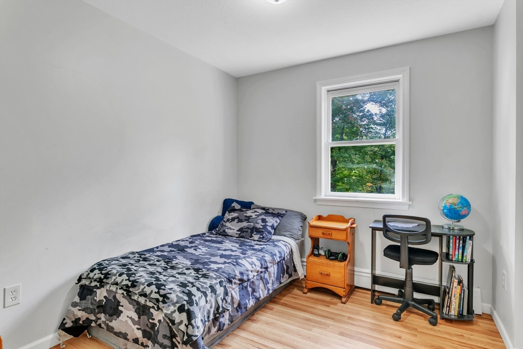 52 Warren Wright Road Belchertown, MA 01007 - Photo 18 of 41 a bedroom with a bed and a window
