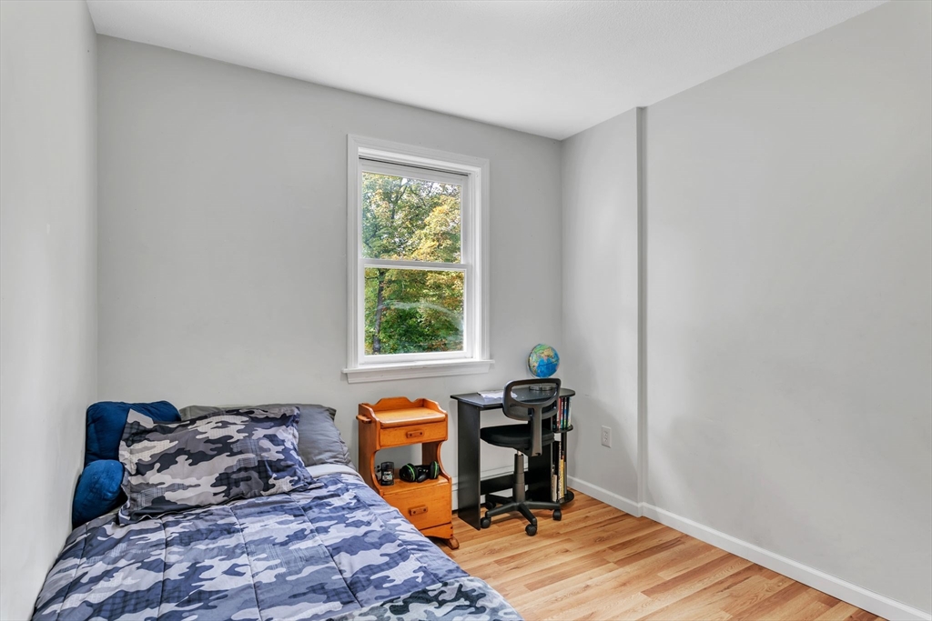 52 Warren Wright Road Belchertown, MA 01007 - Photo 19 of 41 a bedroom with a bed and a window