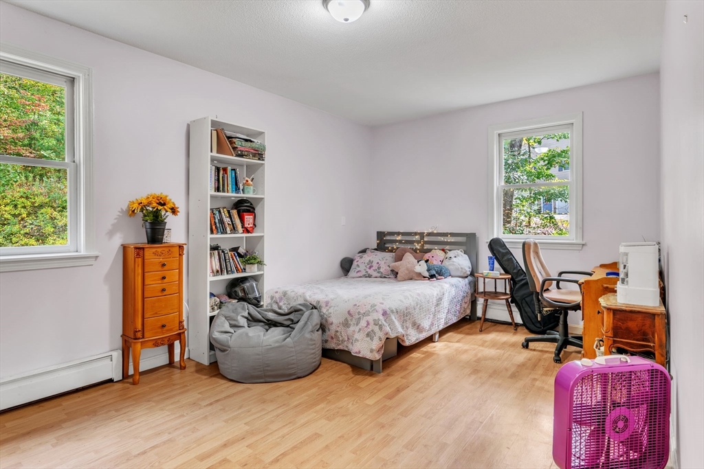52 Warren Wright Road Belchertown, MA 01007 - Photo 21 of 41 a bedroom with furniture and a window