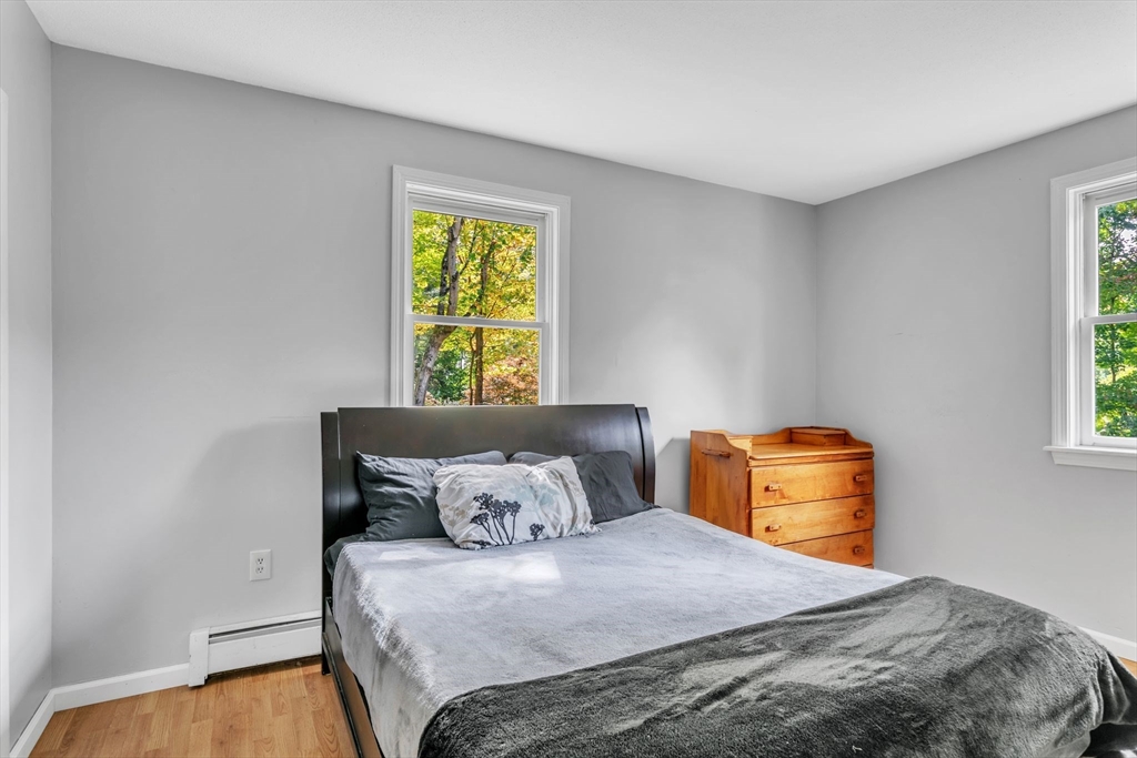 52 Warren Wright Road Belchertown, MA 01007 - Photo 24 of 41 a bedroom with a bed and a window
