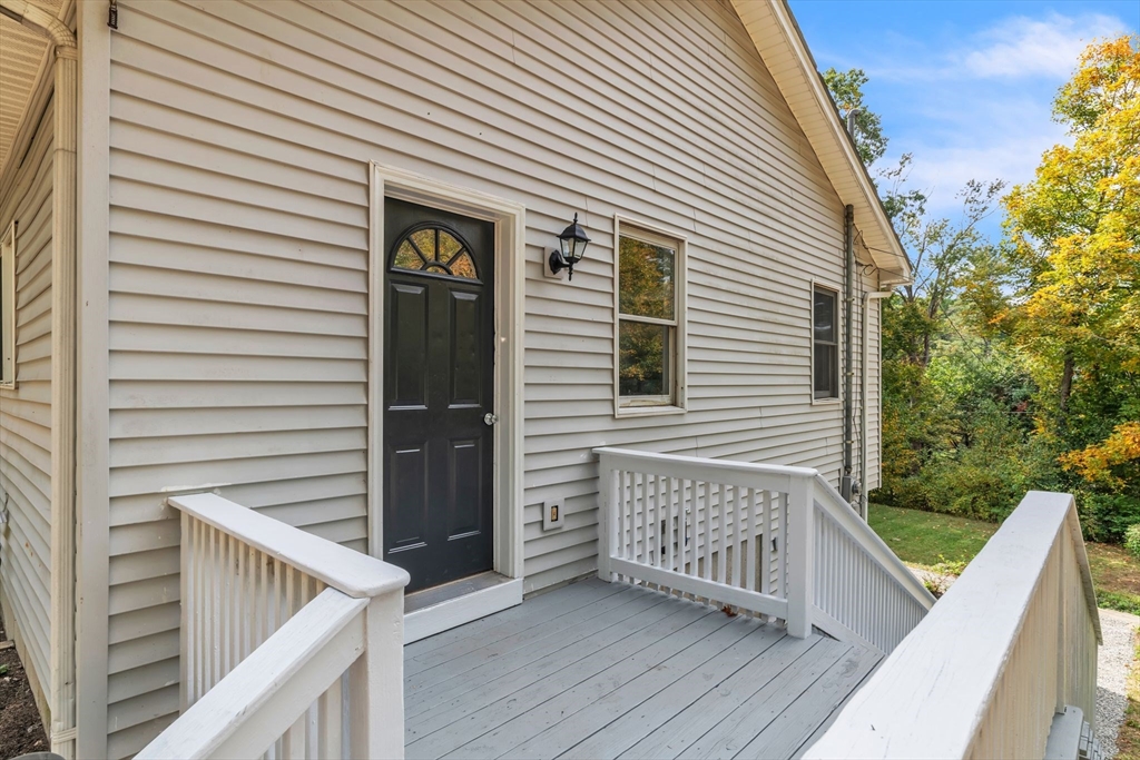 52 Warren Wright Road Belchertown, MA 01007 - Photo 33 of 41 a view of a house with a deck