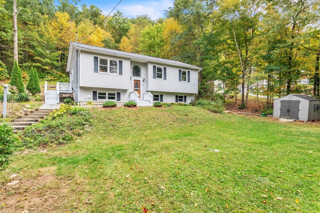 52 Warren Wright Road Belchertown, MA 01007 - Photo 5 of 41 a house view with a garden space