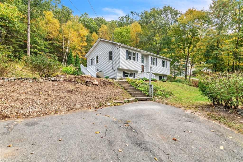 52 Warren Wright Road Belchertown, MA 01007 - Photo 6 of 41 a view of a house with backyard and trees