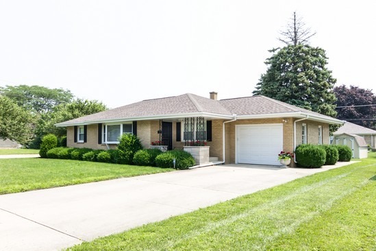914 Westminster Road Joliet, IL 60435 - Photo 1 of 16 a front view of a house with a yard and garage