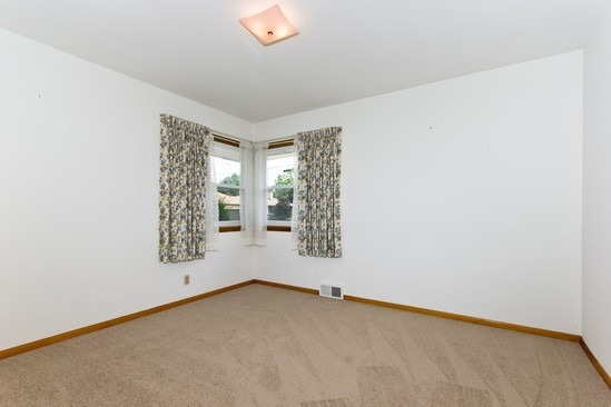 914 Westminster Road Joliet, IL 60435 - Photo 11 of 16 an empty room with windows
