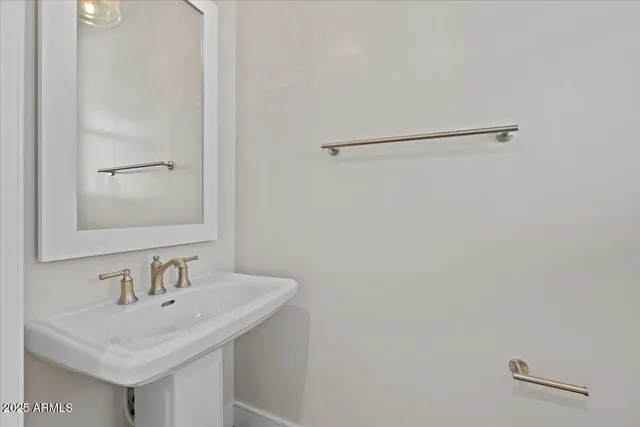 a view of a kitchen with a sink and a large window
