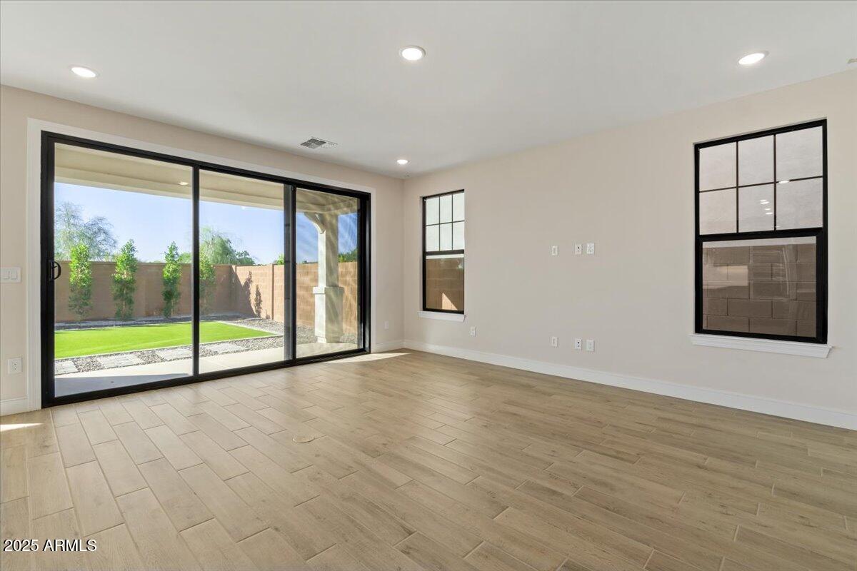 2431 West Los Arboles Place Chandler, AZ 85224 - Photo 11 of 60 a view of an empty room with a window