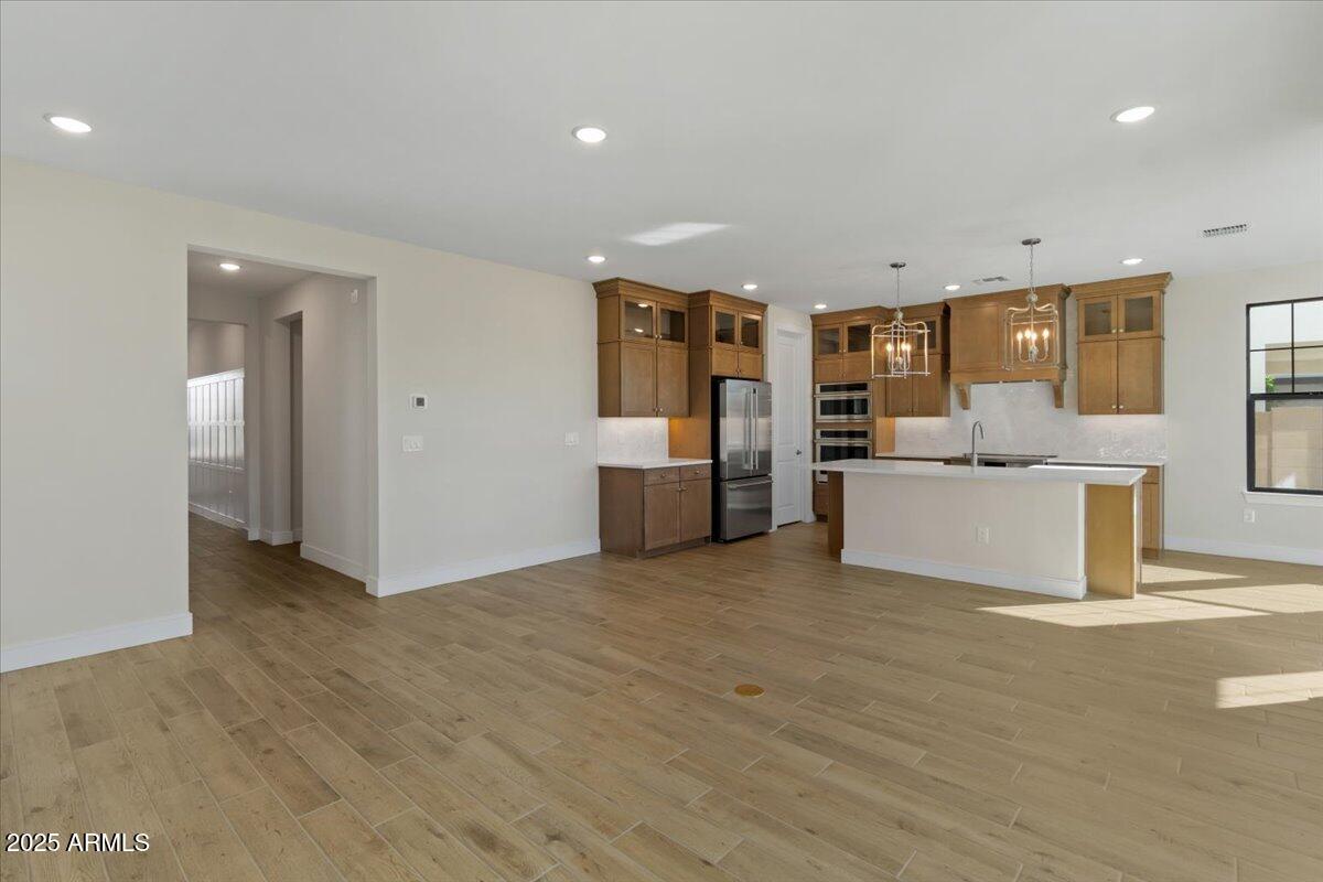 2431 West Los Arboles Place Chandler, AZ 85224 - Photo 14 of 60 a view of a kitchen with a sink and cabinet with a yard