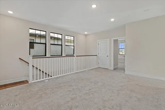 a bathroom with double sink and a mirror