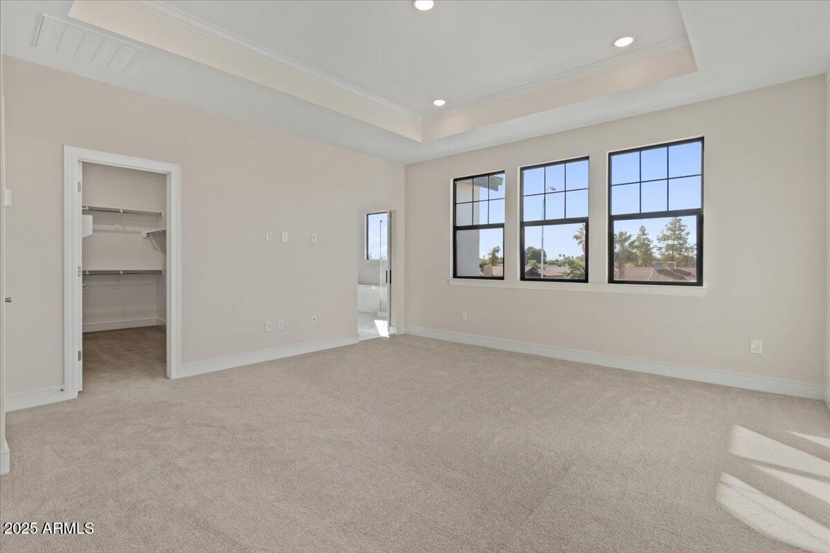 2431 West Los Arboles Place Chandler, AZ 85224 - Photo 33 of 60 a view of an empty room with a window