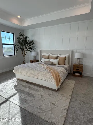 a white tub sitting next to a bathroom