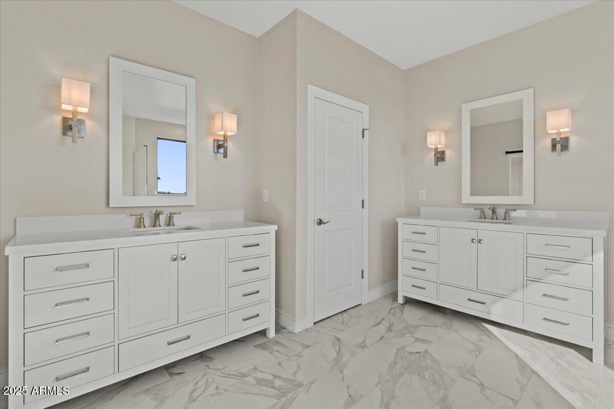 2431 West Los Arboles Place Chandler, AZ 85224 - Photo 36 of 60 a bathroom with double sink and a mirror