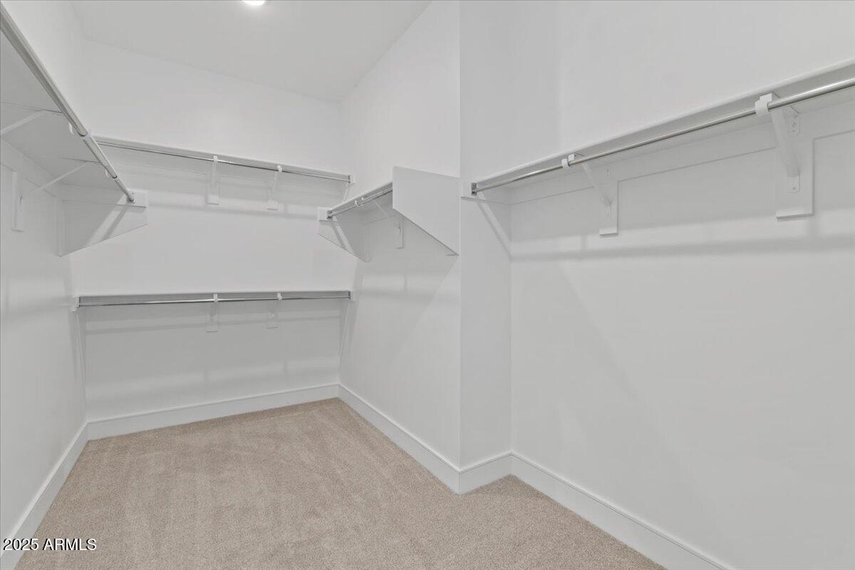 2431 West Los Arboles Place Chandler, AZ 85224 - Photo 38 of 60 a view of an empty walk in closet