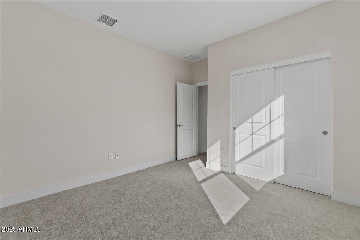 2431 West Los Arboles Place Chandler, AZ 85224 - Photo 40 of 60 an empty room with staircase