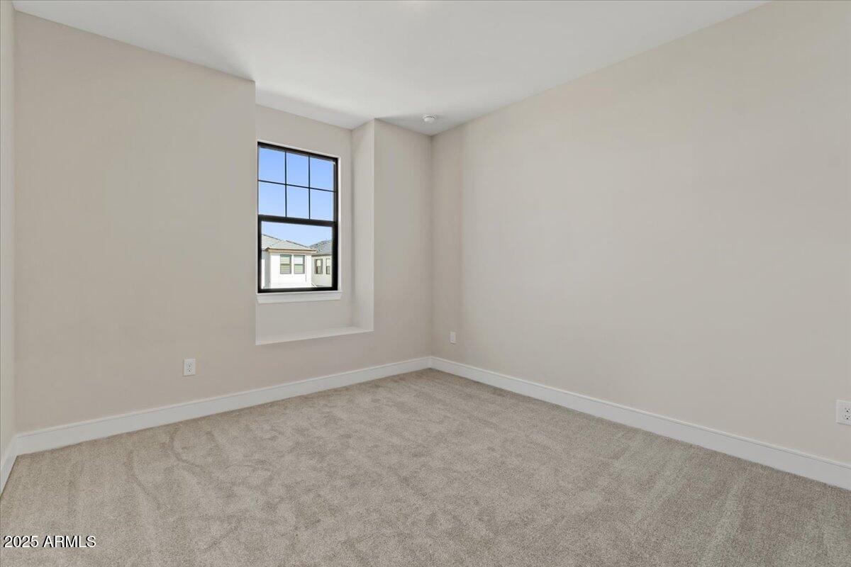2431 West Los Arboles Place Chandler, AZ 85224 - Photo 41 of 60 an empty room with windows