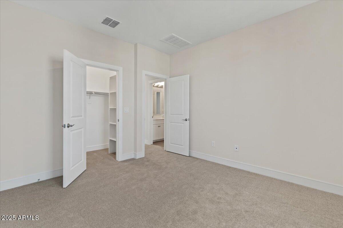 2431 West Los Arboles Place Chandler, AZ 85224 - Photo 42 of 60 an empty room with closet area