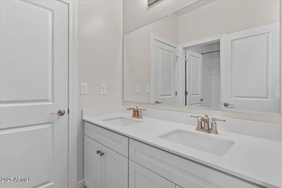 2431 West Los Arboles Place Chandler, AZ 85224 - Photo 43 of 60 a bathroom with a sink and vanity