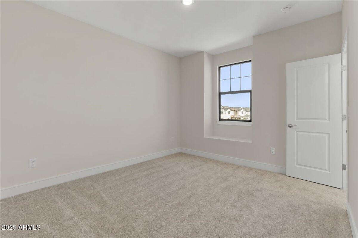 2431 West Los Arboles Place Chandler, AZ 85224 - Photo 45 of 60 an empty room with windows and closet