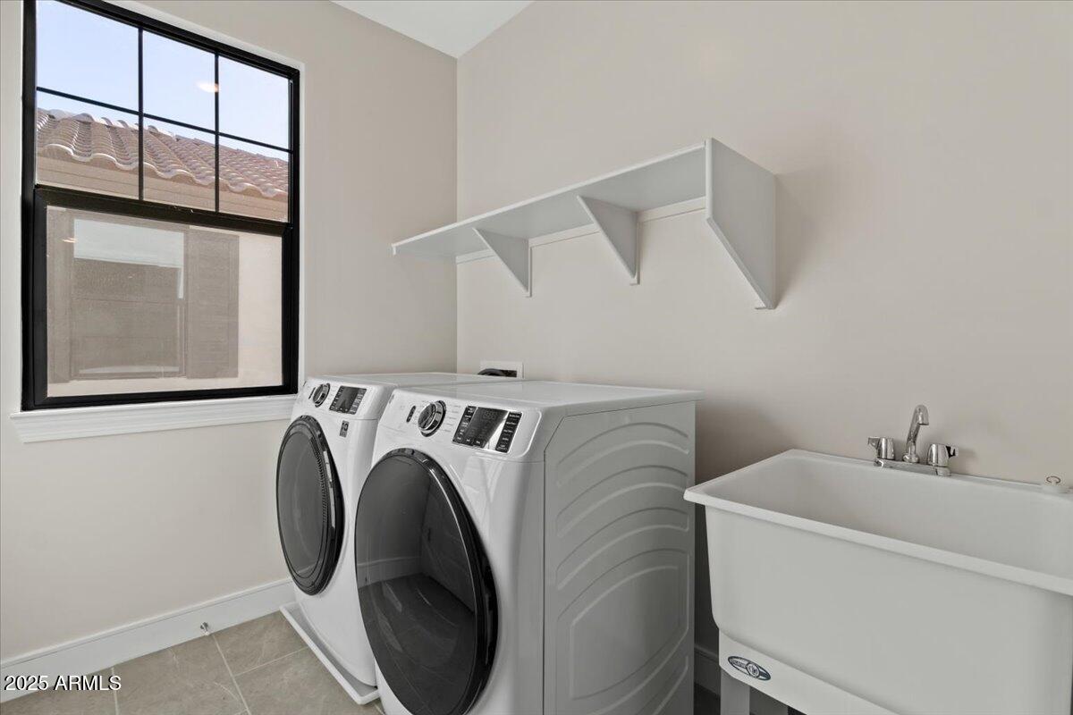 2431 West Los Arboles Place Chandler, AZ 85224 - Photo 47 of 60 a utility room with dryer and washer