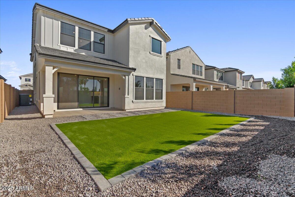 2431 West Los Arboles Place Chandler, AZ 85224 - Photo 51 of 60 a front view of a house with a yard and garage