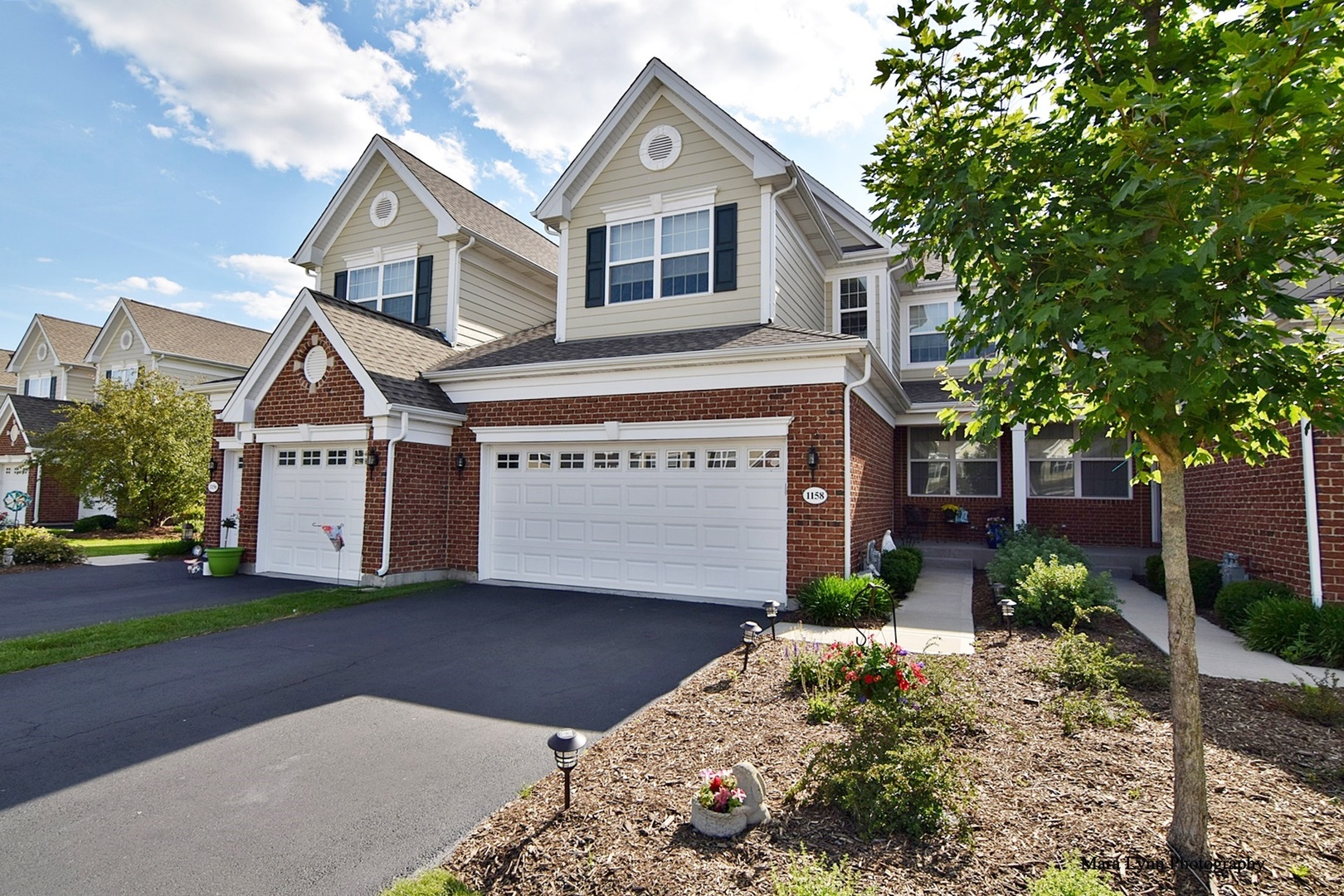 1158 Falcon Ridge Drive Elgin, IL 60124 - Photo 1 of 1 a view of a house with a yard and garage