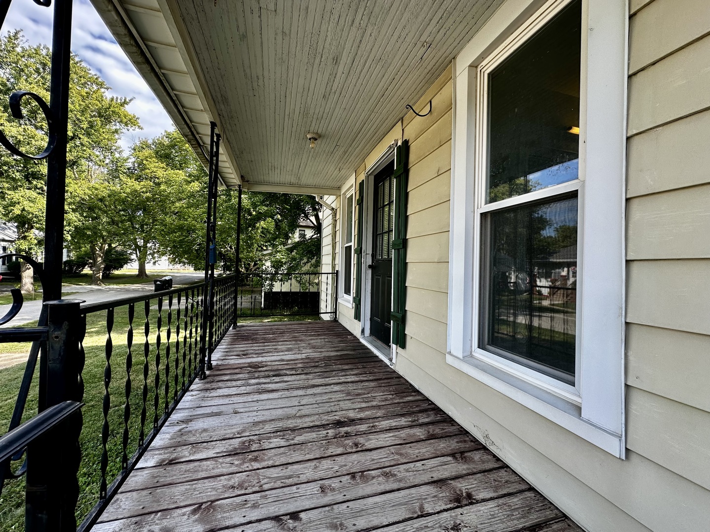 212 North Linden Street Clinton, IL 61727 - Photo 3 of 16 a porch with wooden floor and outdoor space