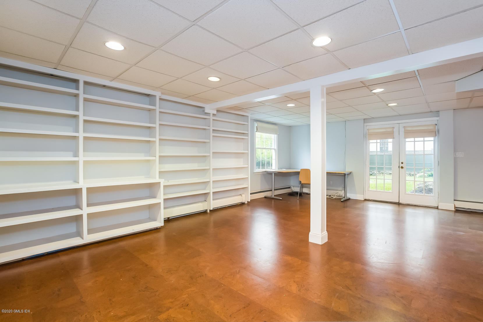 19 Peters Road Riverside, CT 06878 - Photo 13 of 17 a view of an empty room with a window and wooden floor
