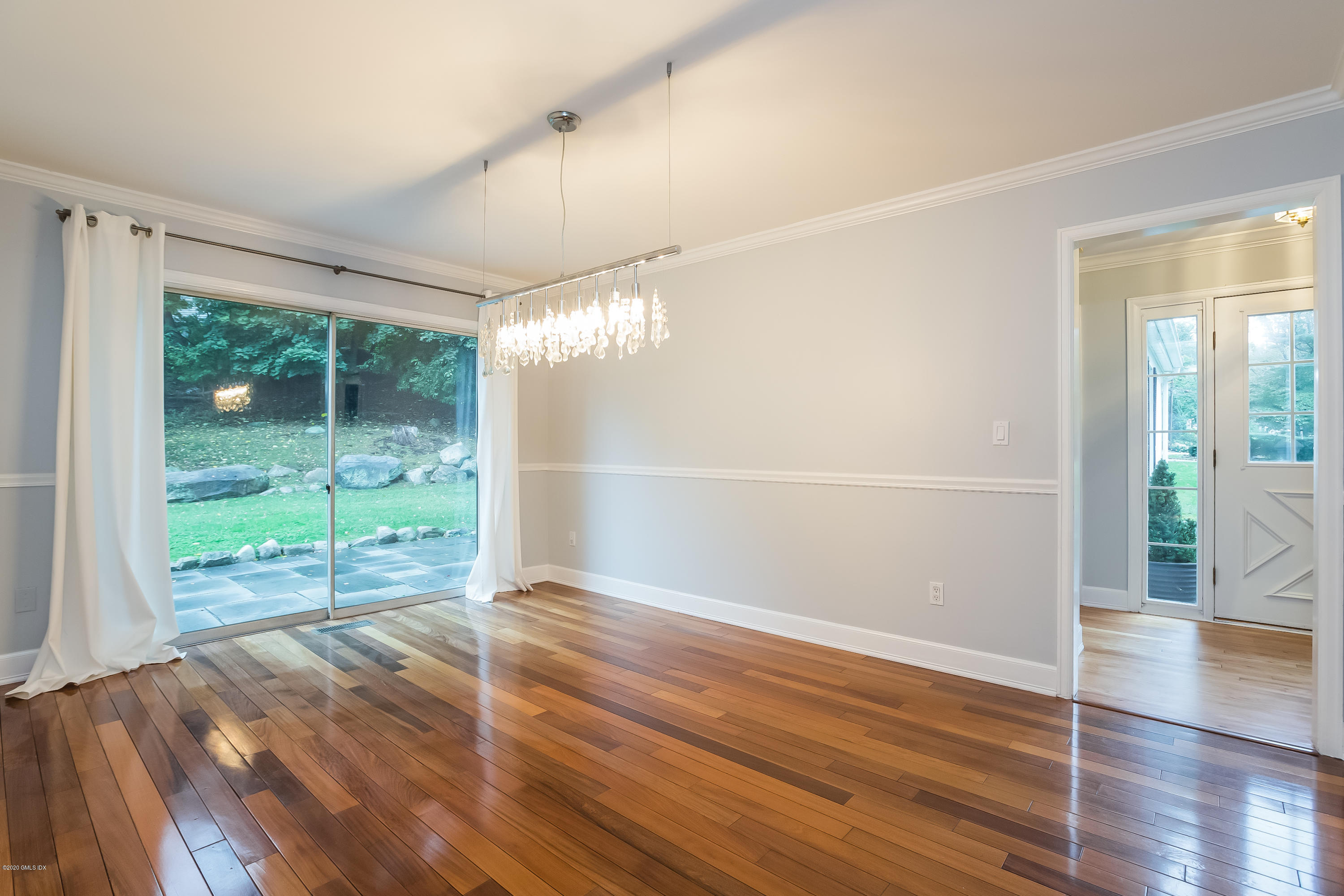 19 Peters Road Riverside, CT 06878 - Photo 5 of 17 an empty room with wooden floor and windows
