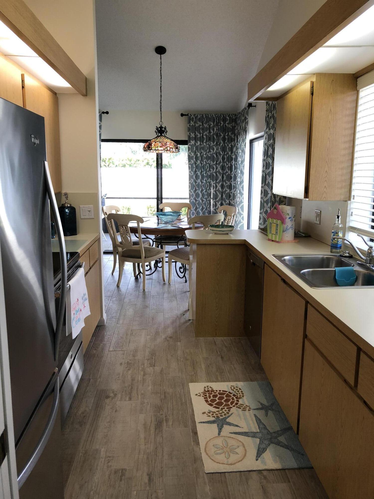 218 Ridge Road Jupiter, FL 33477 - Photo 2 of 7 a kitchen with lots of counter top space