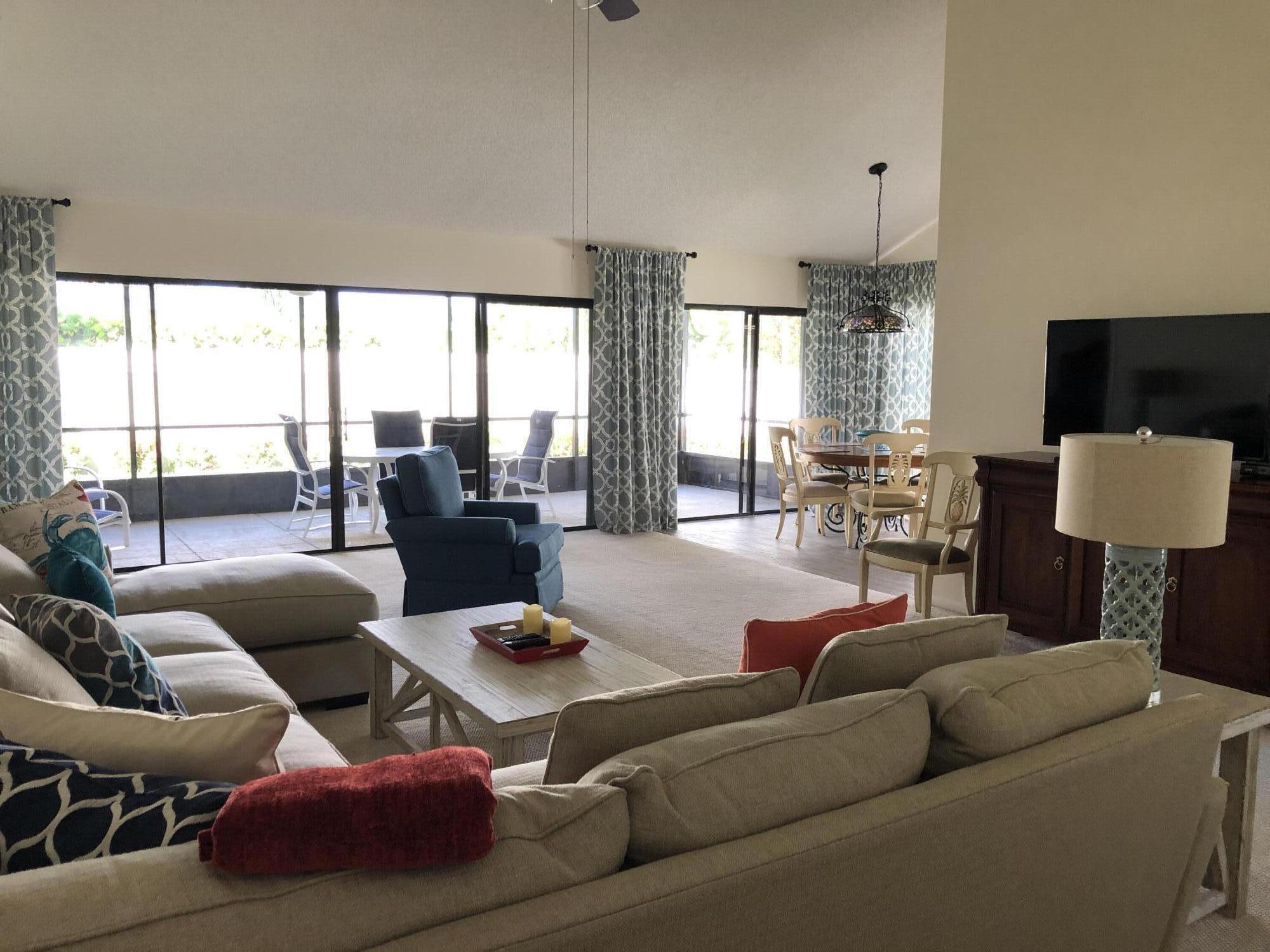 218 Ridge Road Jupiter, FL 33477 - Photo 4 of 7 a living room with furniture and a large window