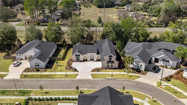 an aerial view of a house with outdoor space
