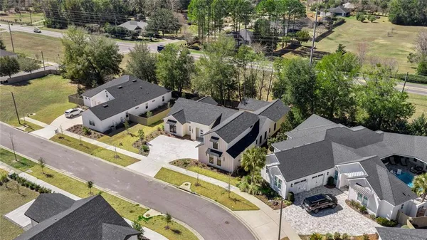 an aerial view of a house with a garden