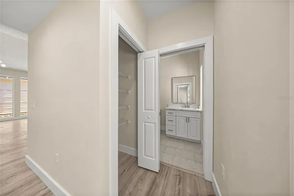 a view of a bathroom from a hallway