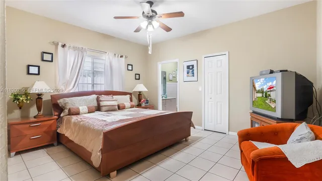 a bedroom with a bed and a couch