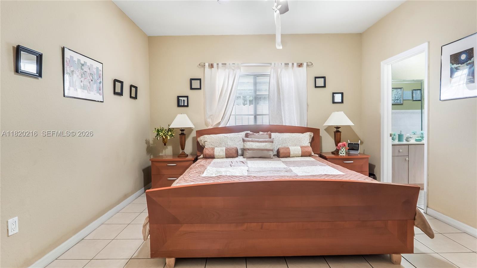 19730 Northwest 78th Avenue Hialeah, FL 33015 - Photo 19 of 30 a room with a bed and wooden floor