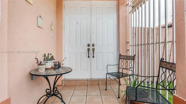 a view of a room with furniture and wooden floor