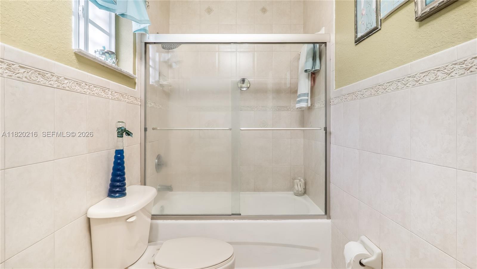 19730 Northwest 78th Avenue Hialeah, FL 33015 - Photo 21 of 30 a bathroom with a shower and a toilet