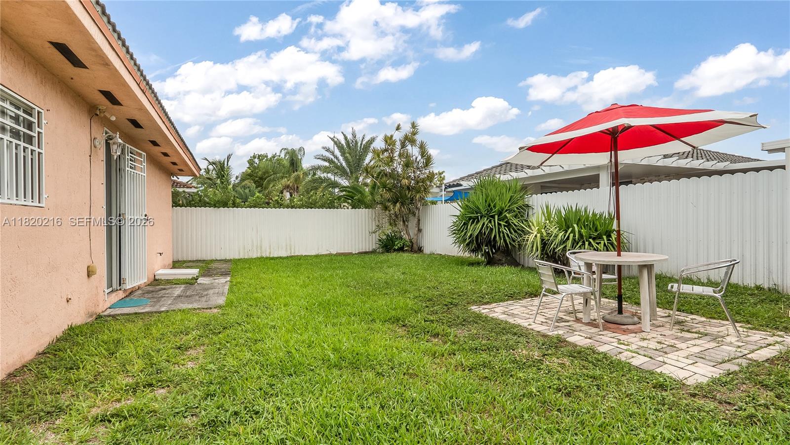 19730 Northwest 78th Avenue Hialeah, FL 33015 - Photo 24 of 30 a view of a house with backyard and sitting area