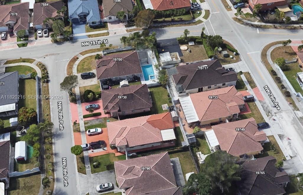 19730 Northwest 78th Avenue Hialeah, FL 33015 - Photo 27 of 30 an aerial view of residential houses with outdoor space and parking