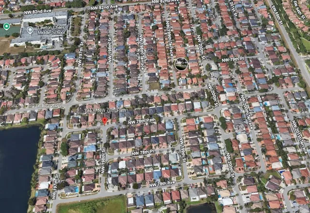 a aerial view of a house with a yard